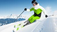 Downhill skier making a sharp turn